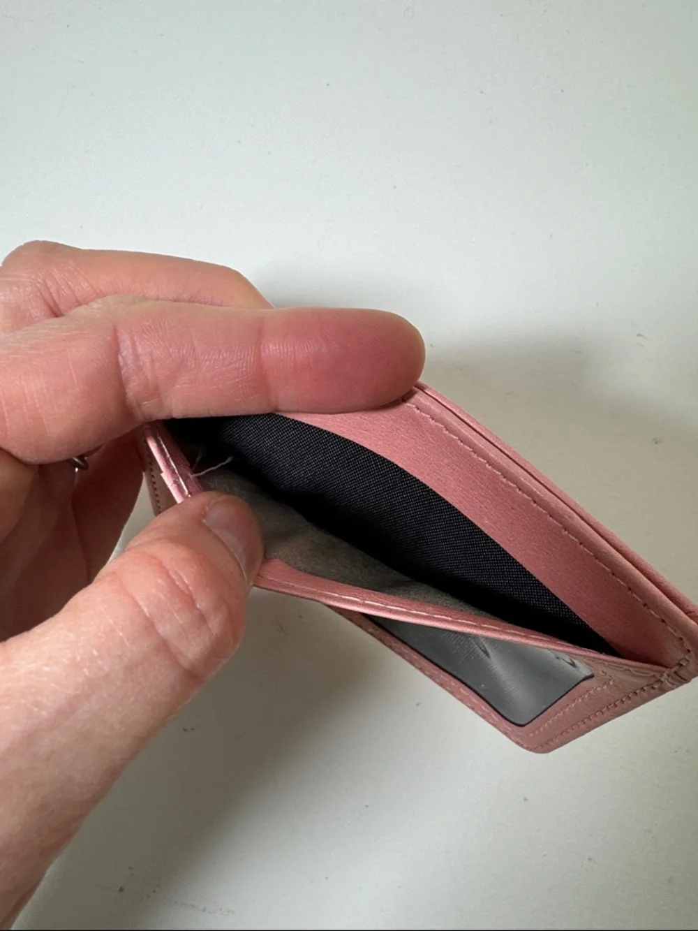 Pink card case.